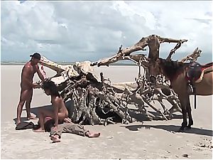 mischievous mexican lady gets 2 meatpipes on the beach